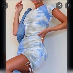 Tye dye white fox boutique dress with adjustable side ties.